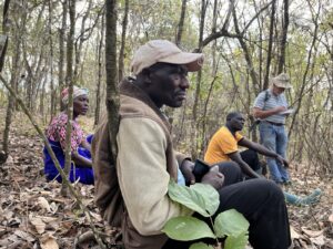 Severina, Damian, and Ezekeli are discussing with FARIP how they can generate a steady income from their forests, which are rich in biodiversity.